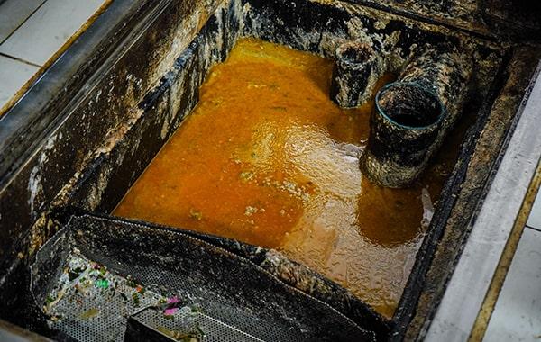 putting off grease trap cleaning can result in clogs, foul odors, and even sewage backups